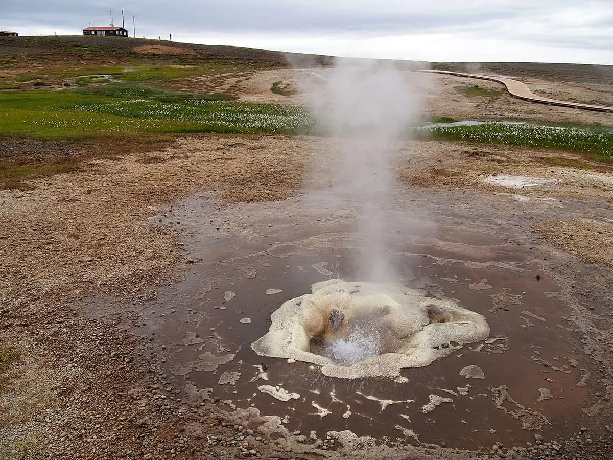 Steam rising from a sinter mound hot spring at Hveravellir in the Icelandic highlands