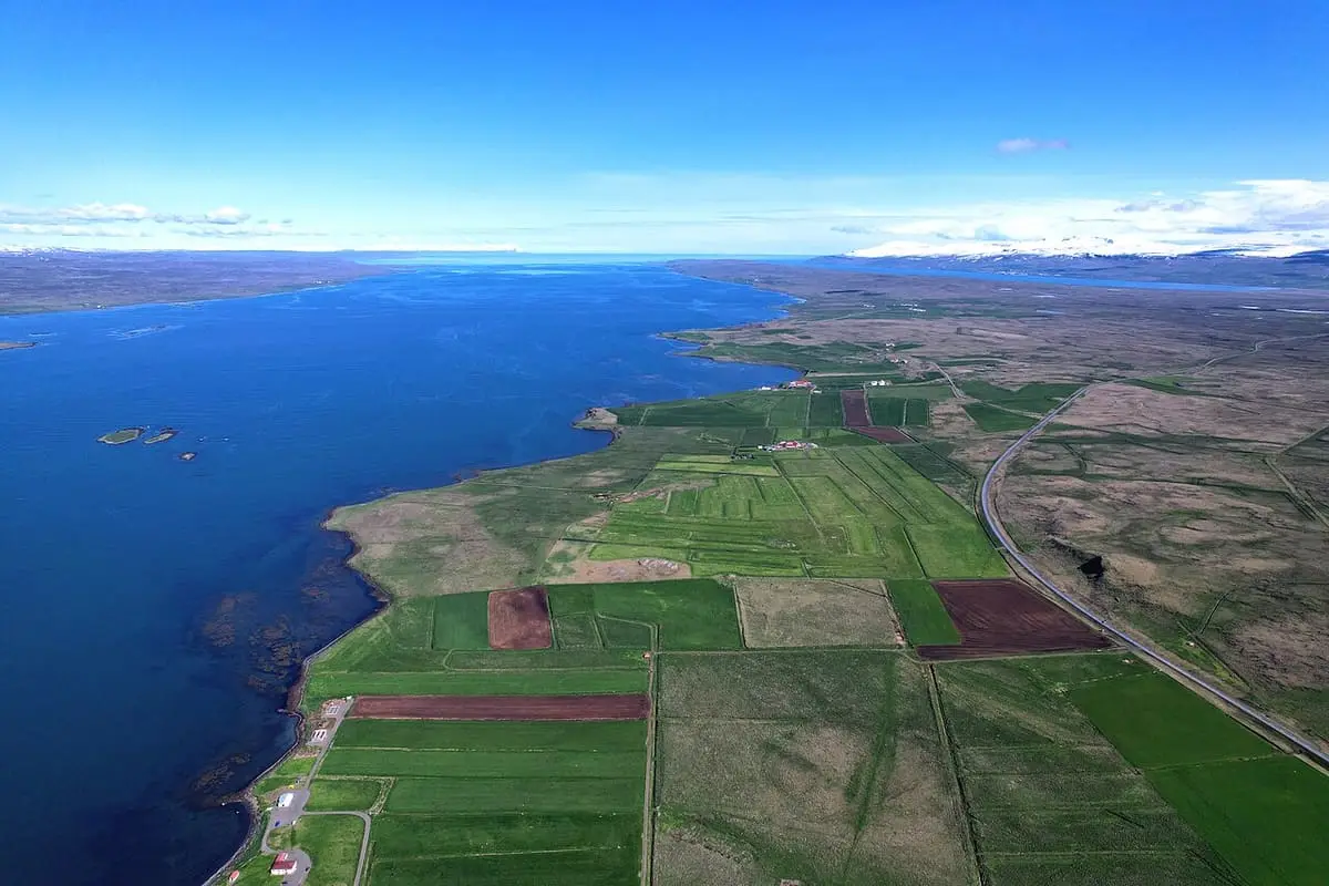 Aerial view of farmland and coastline along Hrútafjörður near Reykir