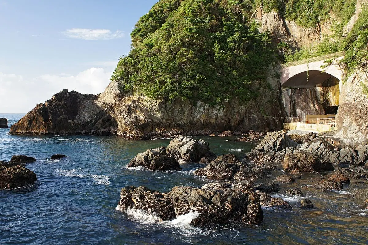 Sea cave entrance of the Bokido bath at Hotel Urashima above rocks and Pacific waves