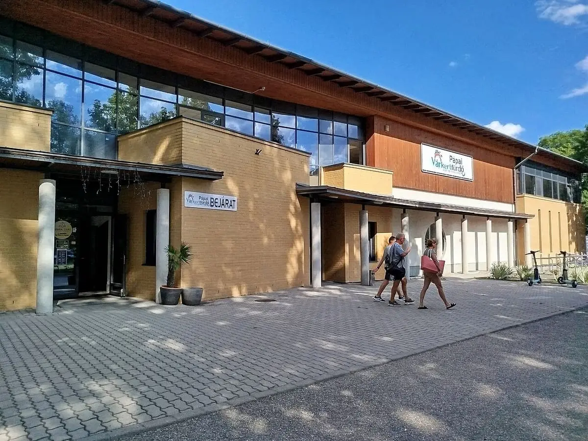 Entrance building of the Várkert bath in Pápa under a blue sky