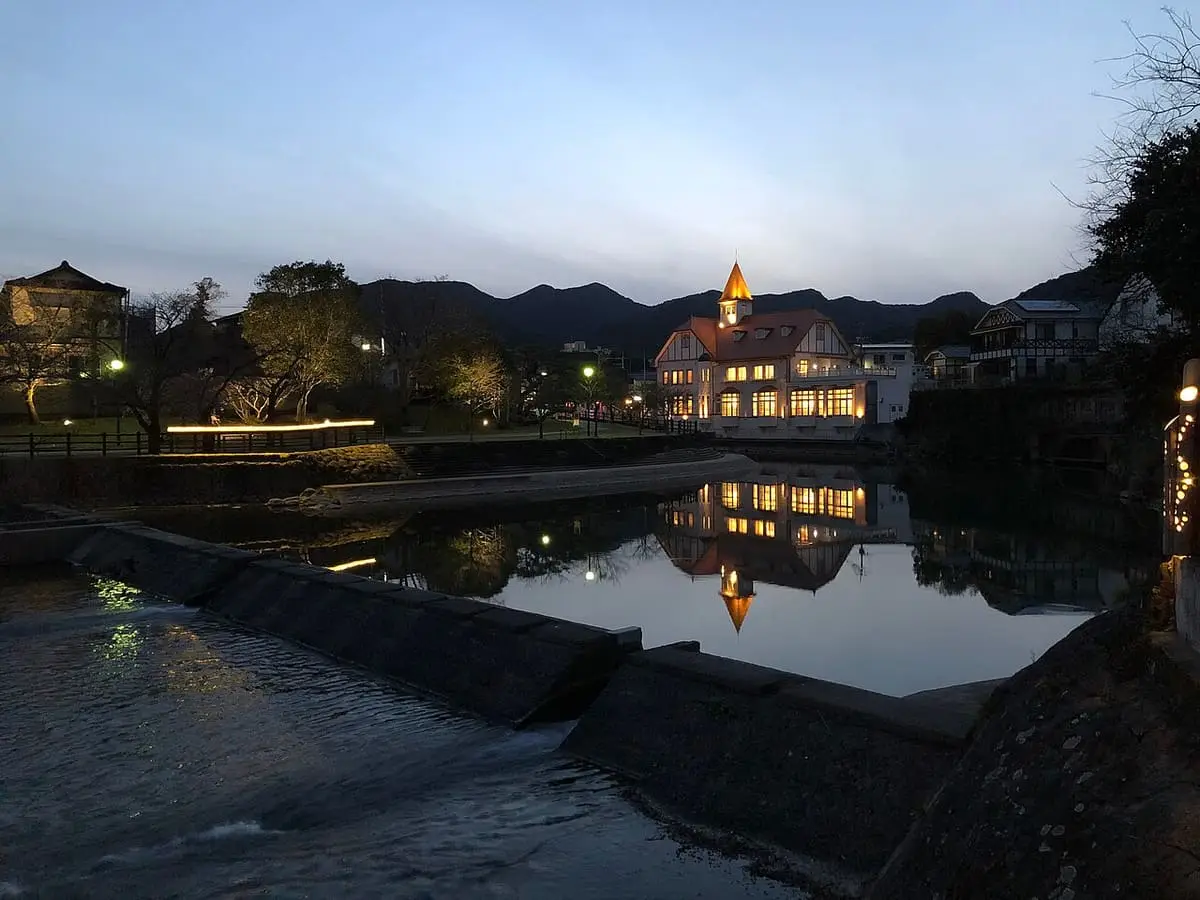 Siebold no Yu lit up at dusk and reflected in the river at Ureshino Onsen