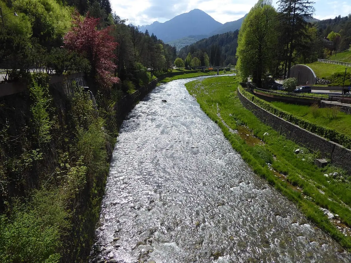Sarca river running between green banks at Terme di Comano