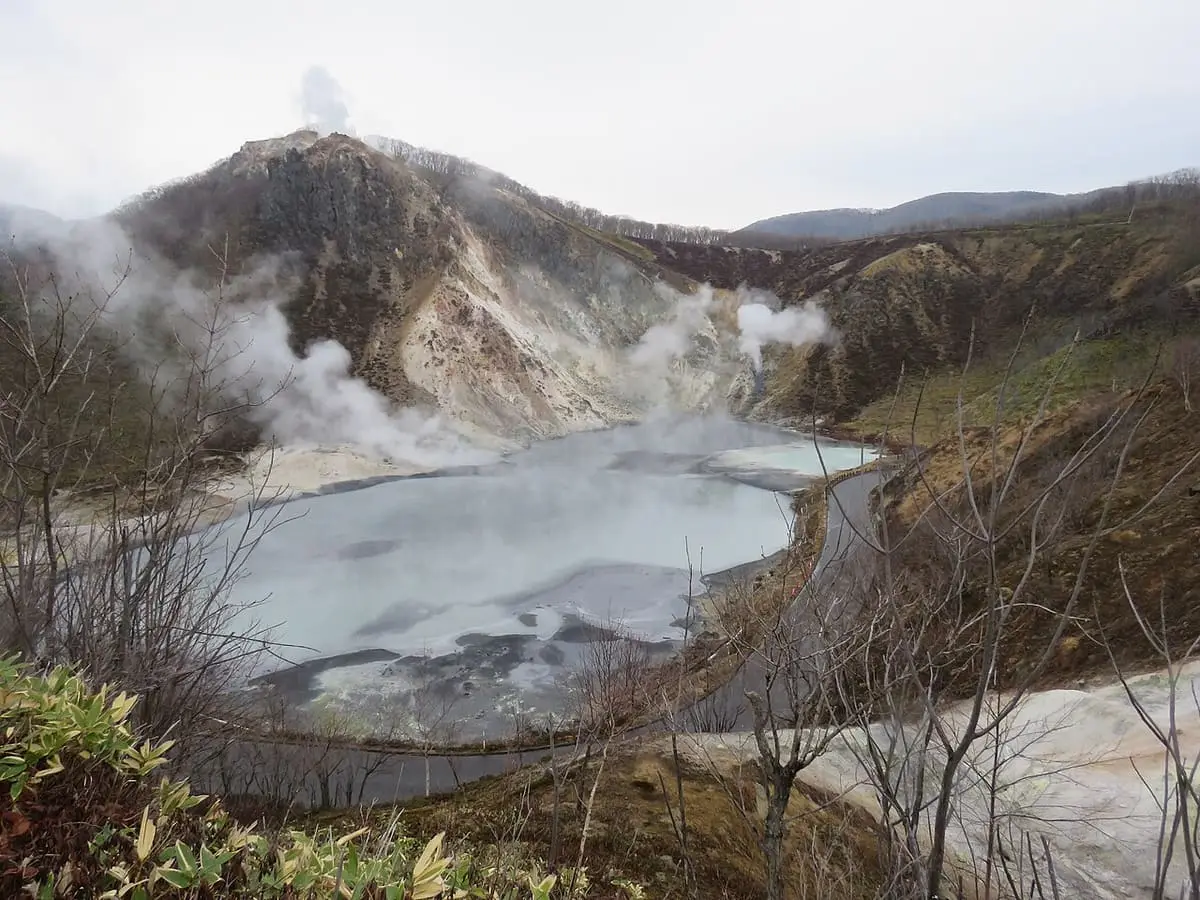 Steaming Oyunuma pond below Mount Hiyori near Noboribetsu Onsen