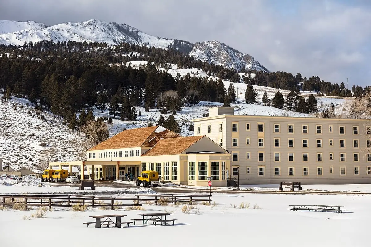 Mammoth Hot Springs Hotel and dining building in winter snow below Sepulcher Mountain