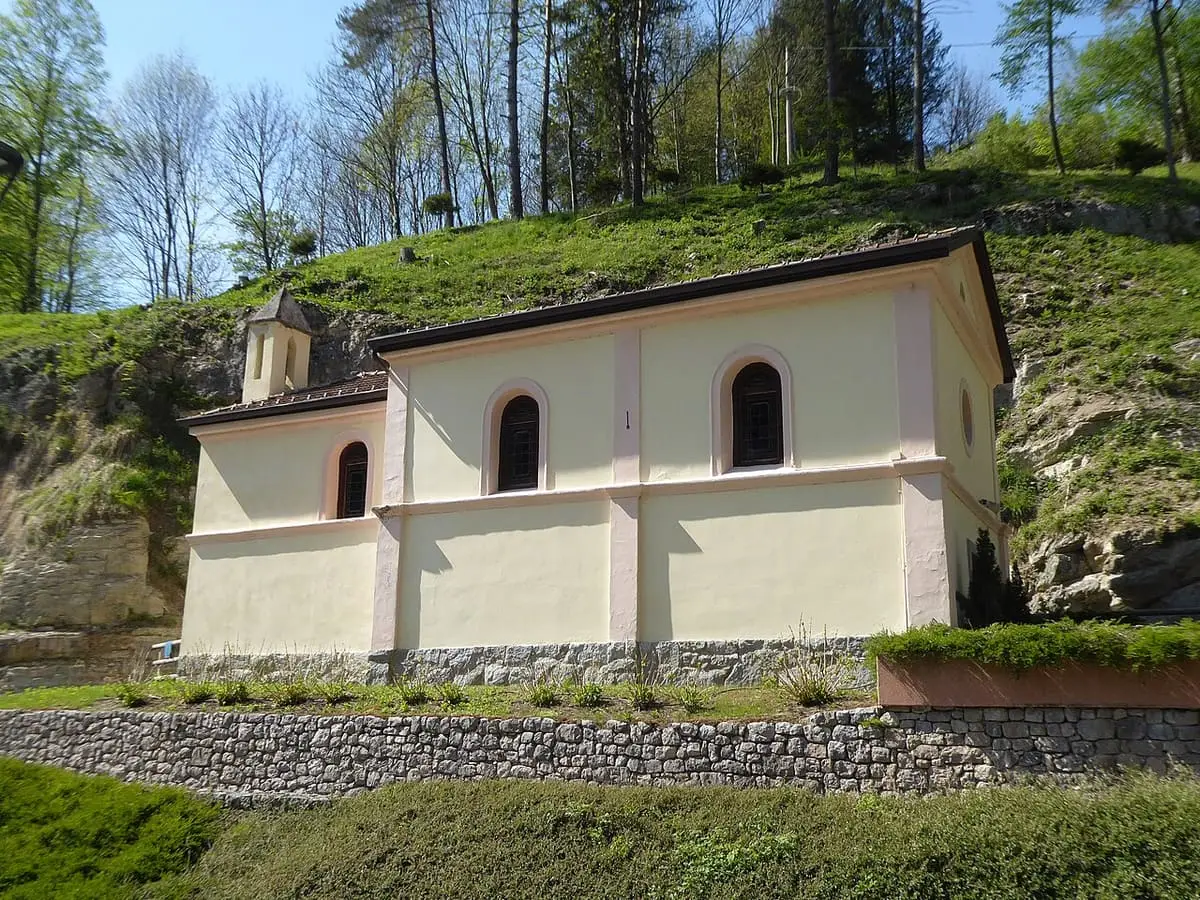 Small church of Our Lady of the Rosary on a wooded slope at Terme di Comano