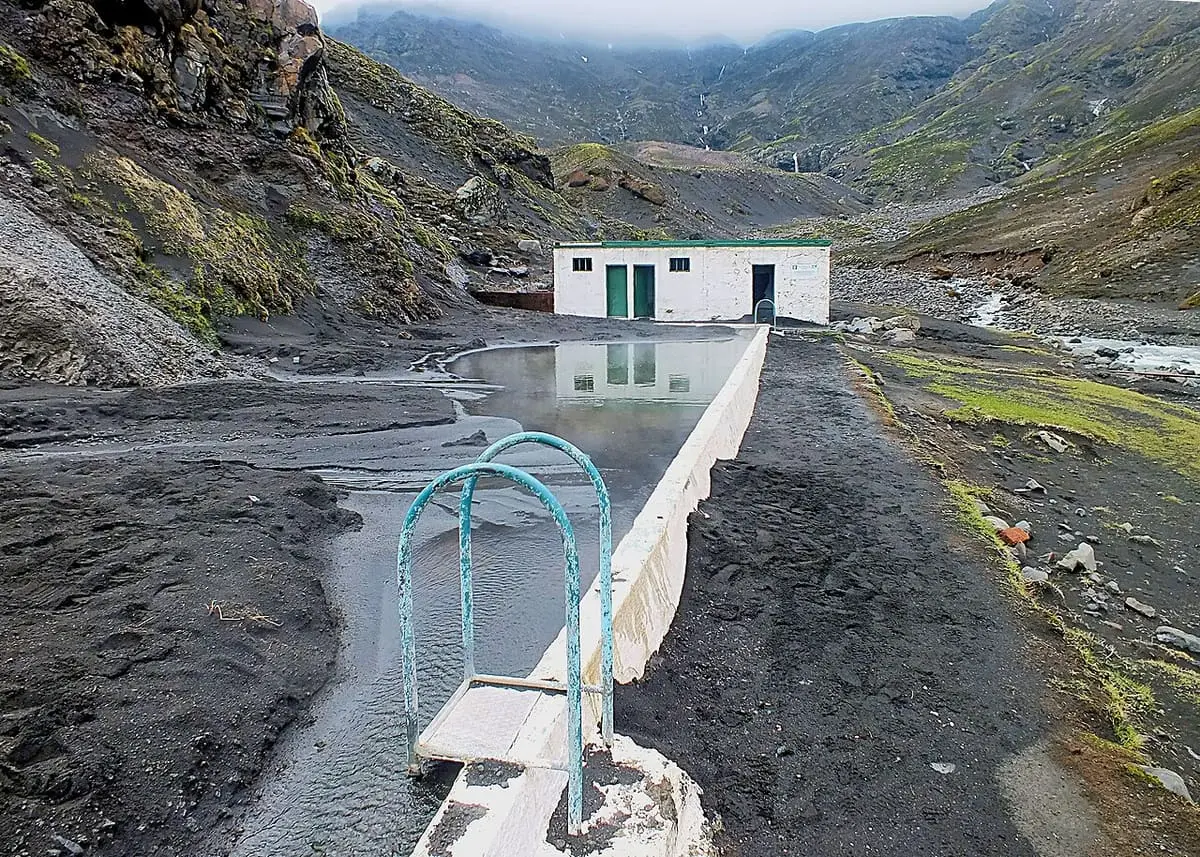 Seljavallalaug pool partly filled with grey volcanic ash from the 2010 Eyjafjallajökull eruption