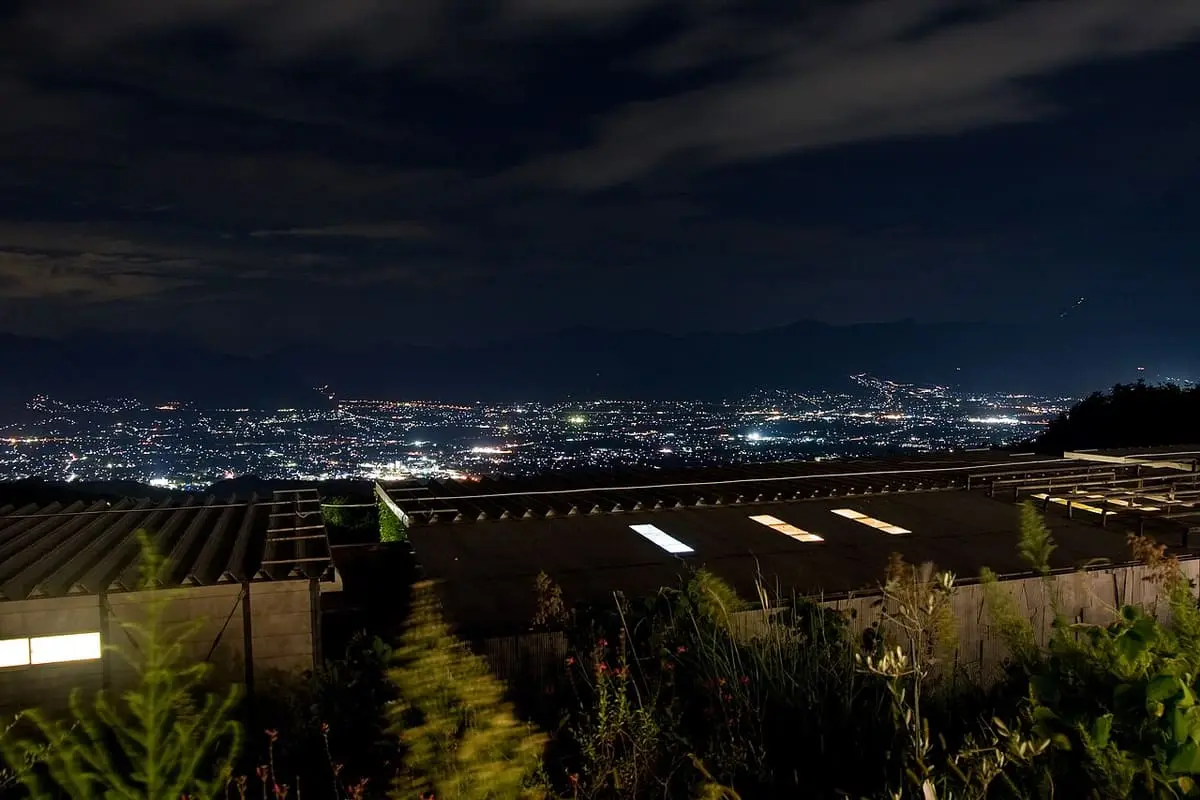 Night lights of the Kofu Basin spreading below the hillside at Hottarakashi Onsen