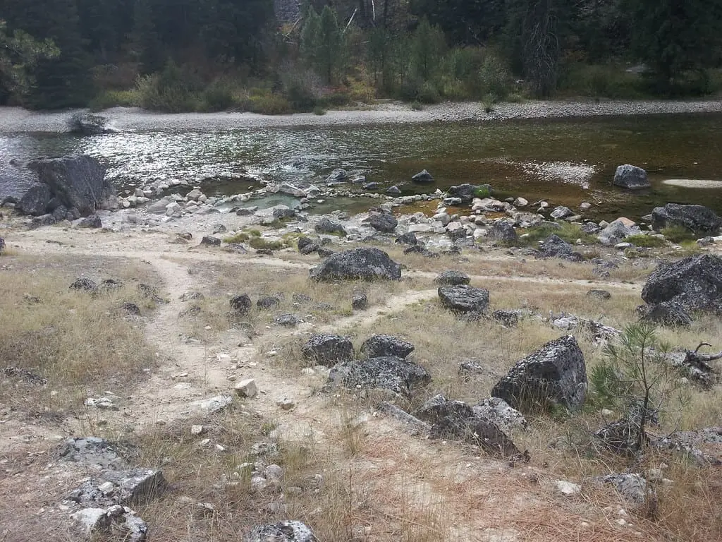 Rocky trail leading down to the riverside pools at Sacajawea Hot Springs
