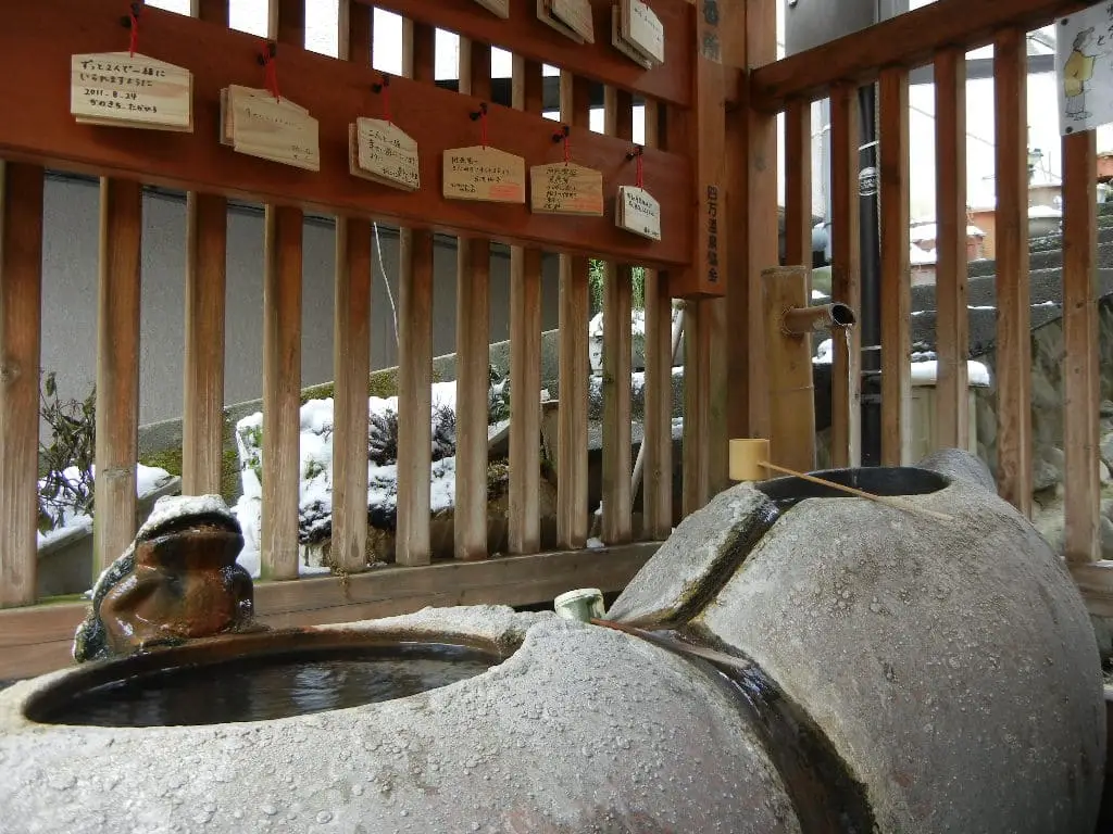Stone basin of the Shionoyu hot spring drinking fountain at Shima Onsen