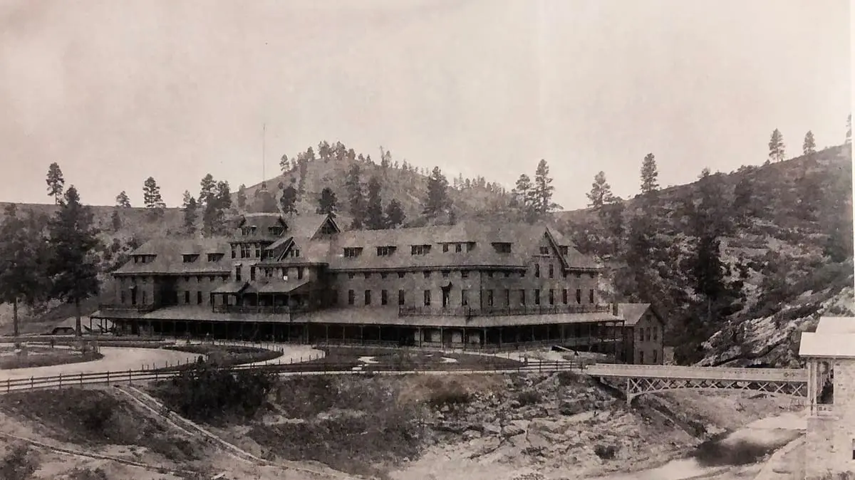 Historic view of the first Montezuma Hotel and Bathhouse at the hot springs, about 1881 to 1884