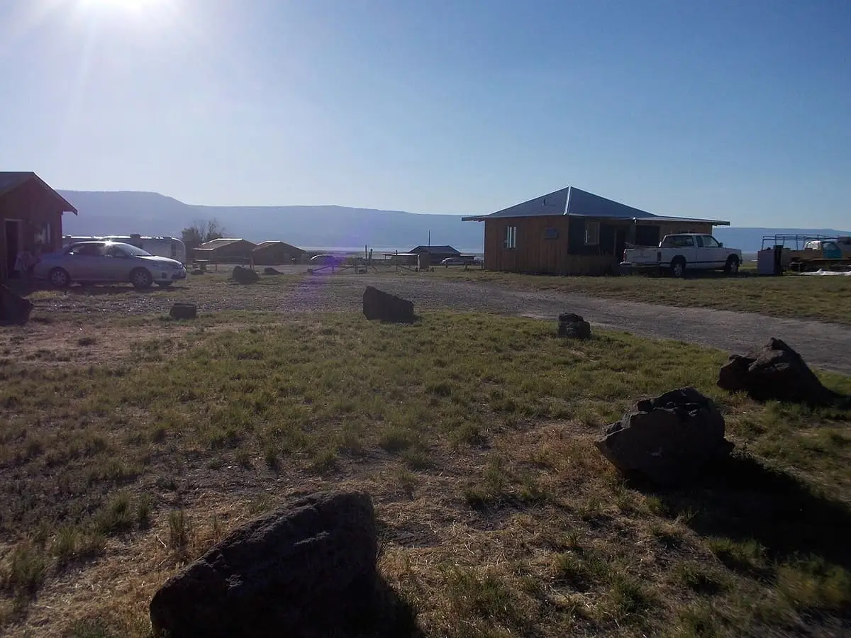 Cabins and lava boulders on the high desert grounds of Summer Lake Hot Springs