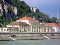 Rudas Thermal Bath buildings on the Danube embankment below the rocky slopes of Gellért Hill