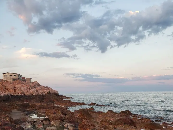 Rocky tide pools of hot spring water on the Sea of Cortez shore at Puertecitos