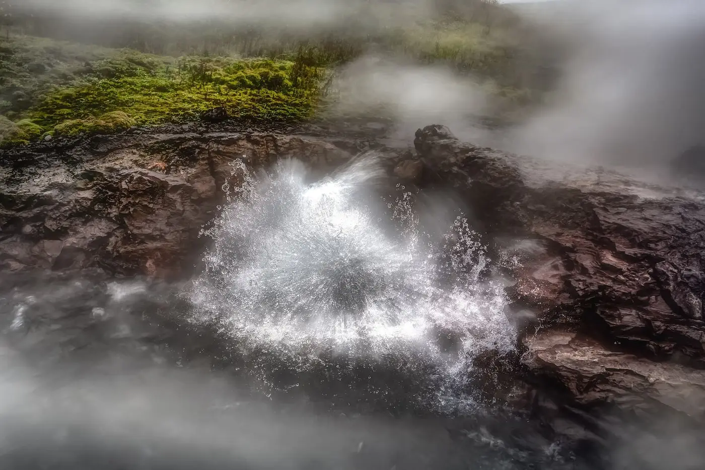 Boiling water splashing from Deildartunguhver hot spring, the source that feeds Krauma
