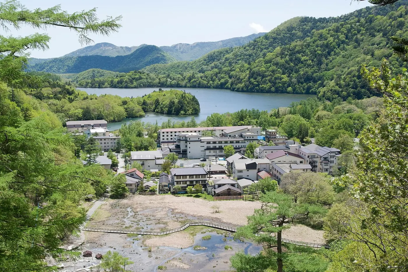 Okunikko Yumoto Onsen village and its steaming source field at the head of Lake Yunoko