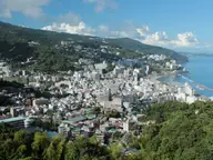 Hillside view over downtown Atami and its hot spring hotels along the blue Sagami Bay coast