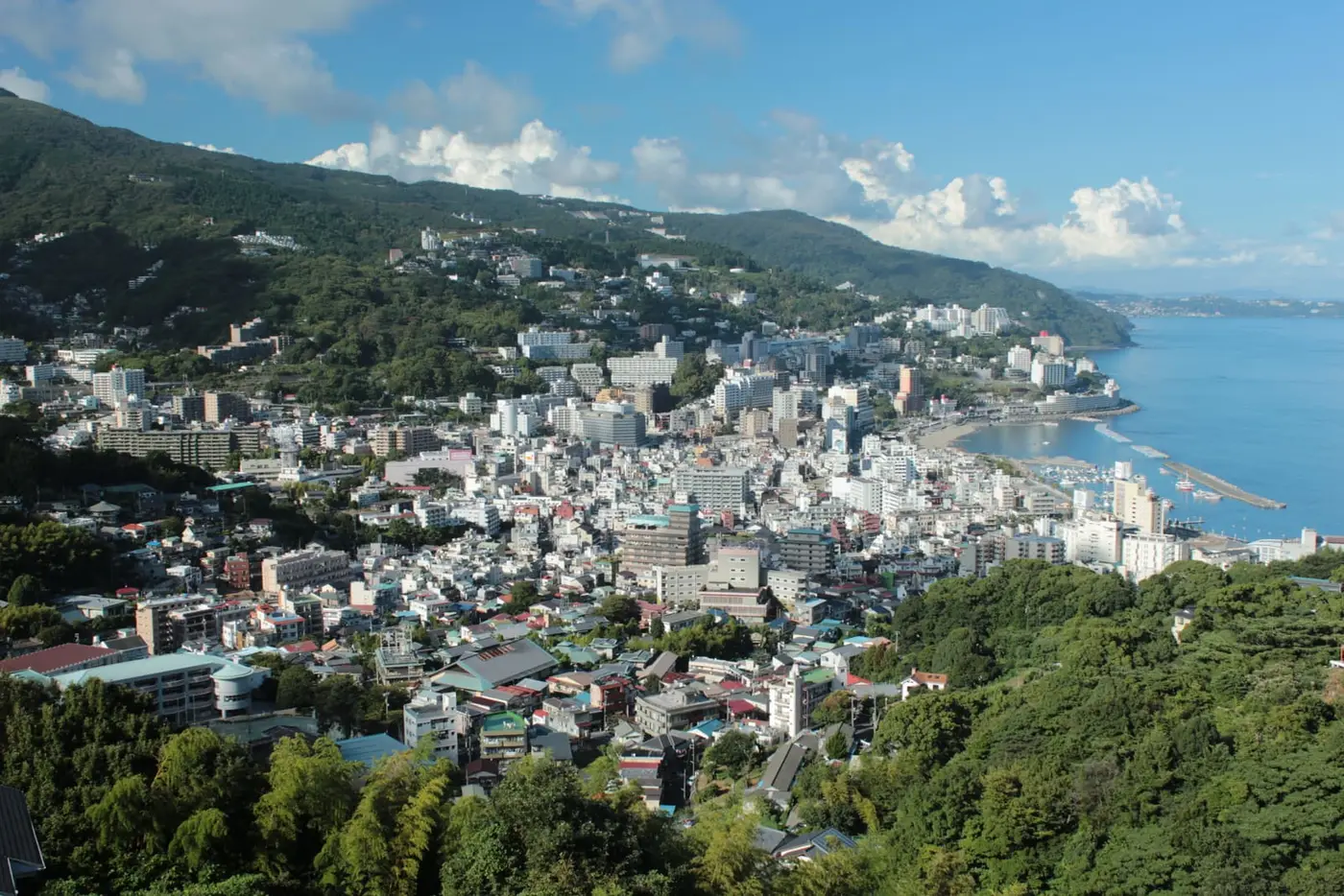 Hillside view over downtown Atami and its hot spring hotels along the blue Sagami Bay coast