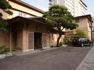 Traditional ryokan entrance with a pine tree in Hakodate Yunokawa Onsen