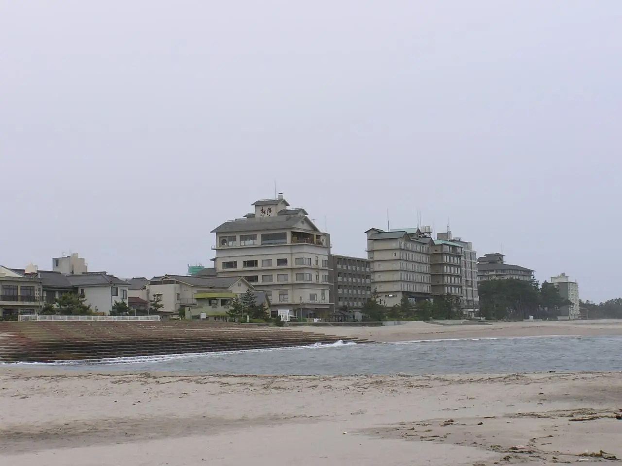 Hotels of Kaike Onsen lining the sandy beach on the Sea of Japan