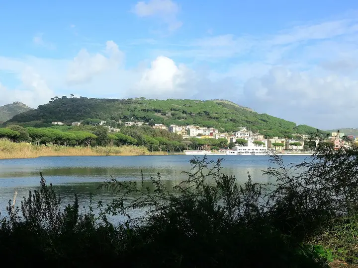 Lake Lucrino with the green cone of Monte Nuovo behind, below the Stufe di Nerone hillside