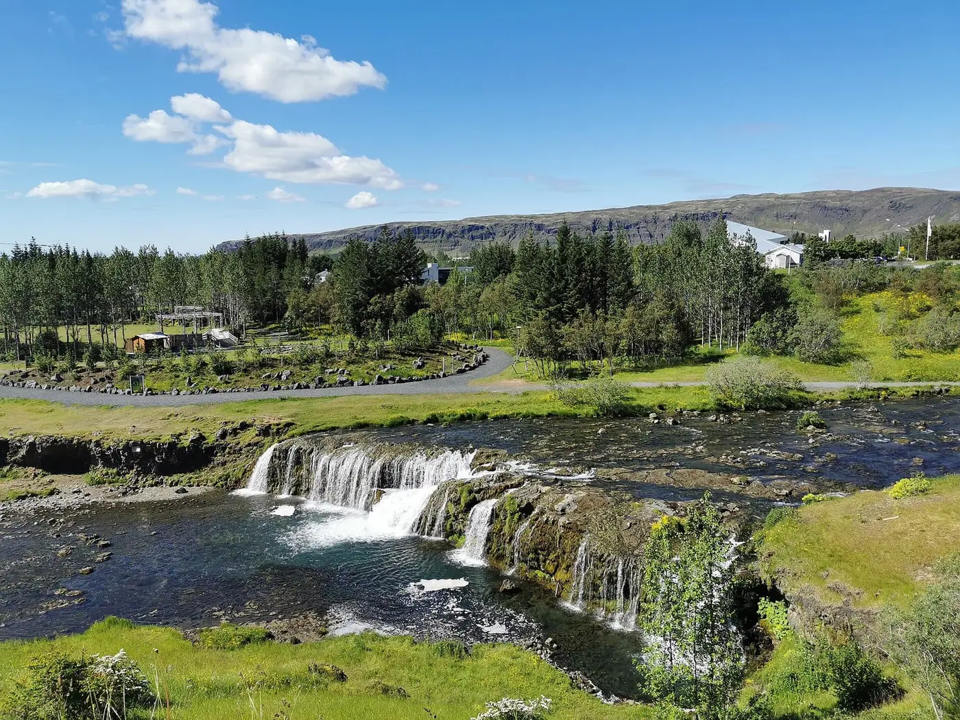 Reykjafoss waterfall on the Varmá river in Hveragerði near the Laugaskarð pool