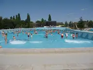Outdoor wave pool with blue water at the Zsóry thermal bath in Mezőkövesd